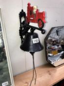 An exterior cast iron fire engine bell