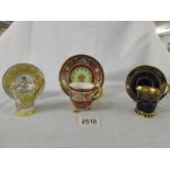 Three hand painted Vienna tea cups and saucers, in good condition.