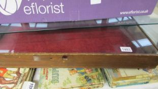 A glass display case ****Condition report**** glass just sits into raised edges,