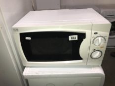 A Curry's Essentials 700 watt microwave