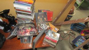 A quantity of CD's and cassette tapes.
