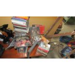 A quantity of CD's and cassette tapes.