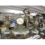 A French marble and spelter clock garniture, in working order.