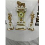 A white marble and gilt clock garniture - The clock being a four pillar design and mounted with a
