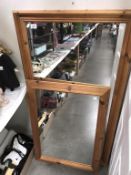 A large pine framed mirror 134 x 73cm