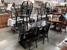 A black oak pub style dining table & 6 wheel back chairs (183cm x 81cm x 75cm high)