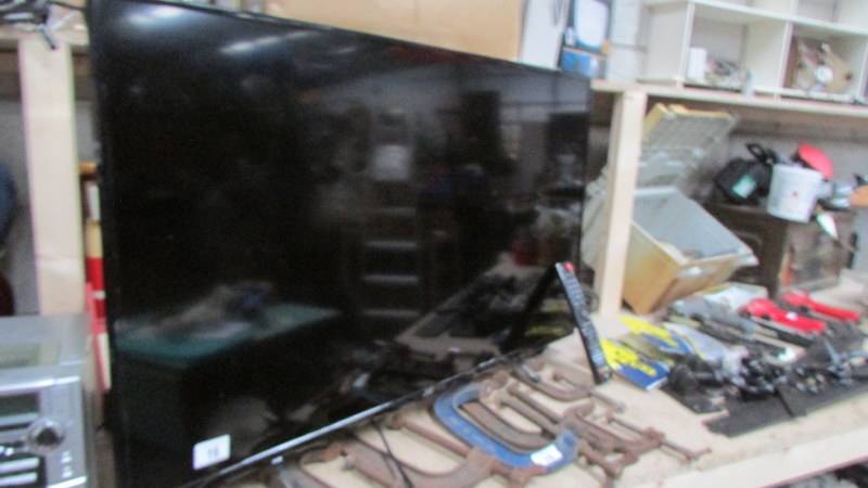 A JVC television with remote. (Collect only) ****Condition report**** 40" screen.