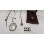 A silver locket, a silver gilt pendant and a silver St Christopher etc.