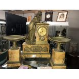 A late 19th century three piece marble and bronze clock garniture, the clock with silk suspension,