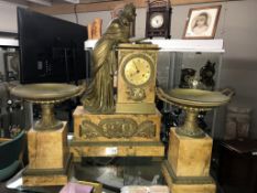 A late 19th century three piece marble and bronze clock garniture, the clock with silk suspension,