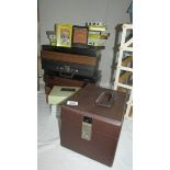 A 45 rpm record case, cassette cases etc.