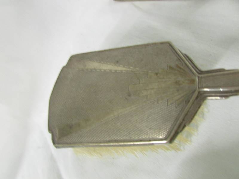 A silver backed vanity set comprising hand mirror, 2 hair brushes and 2 other brushes, - Image 2 of 6