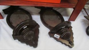 A pair of mirror backed shelf sconces