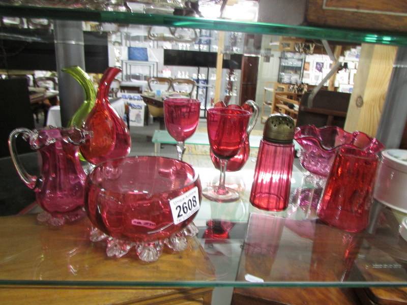 Nine pieces of cranberry glass, some a/f.