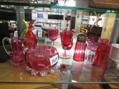 Nine pieces of cranberry glass, some a/f.