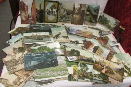 Approximately 65 vintage topographical postcards.