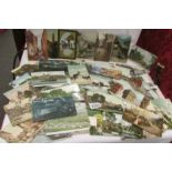 Approximately 65 vintage topographical postcards.