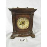 A small oak bracket clock, needs attention.