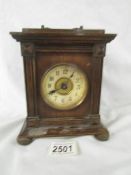 A small oak bracket clock, needs attention.