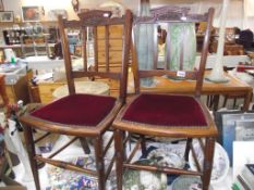 A pair of Edwardian mahogany hall chairs
