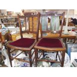 A pair of Edwardian mahogany hall chairs