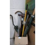 A quantity of walking sticks and umbrella's.