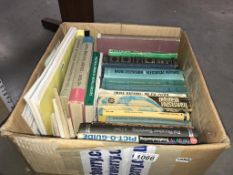 A box of books about electronics,