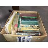 A box of books about electronics,