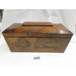 A Victorian mahogany tea caddy.