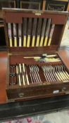 An oak cased Walker and Hall canteen of cutlery, missing 2 Knives, 1 fork and 2 teaspoons.