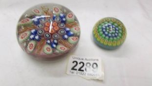 Two millifiori glass paperweights, in good condition.