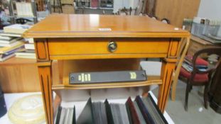 A vintage style coffee table with magazine rack 55.