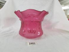 An etched cranberry glass oil lamp shade, in good condition.