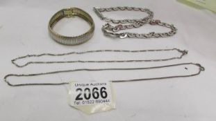 A heavy silver neck chain (Mexico), a silver bracelet (Italy) and two silver chains,