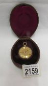 An 18ct gold ladies fob watch with fine chased case, in working order.