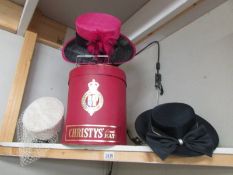 A Christy's of London hat box and three vintage hats.