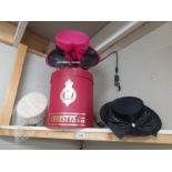 A Christy's of London hat box and three vintage hats.