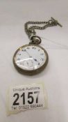 An old pocket watch with chain in working order.