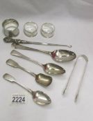 Four silver spoons, three silver napkin rings,