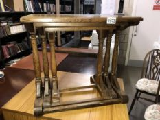 A 1950's oak nest of tables with turned legs (49.5cm x 34cm x 45.