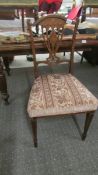 A good quality mahogany inlaid chair on tapered legs.