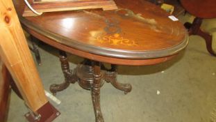 A small oval mahogany inlaid table, top needs re-polishing,