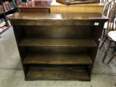 A dark oak bookcase (99cm x 26cm x 94cm high)