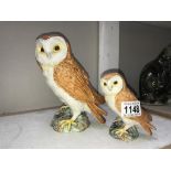 A large Beswick owl & a smaller Beswick owl