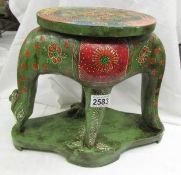 A painted wooden anteater plant stand/stool.