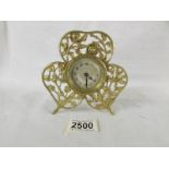 A small brass boudior clock.