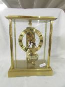 A good quality brass skeleton style clock in working order.