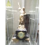 A 19th century French marble and gilt mantle clock with enamel dial and surmounted female figure.