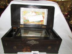 A Victorian music box playing 6 airs, in working order.
