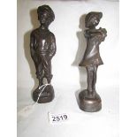 A pair of boy and girl bronze figures, 23 cm tall.